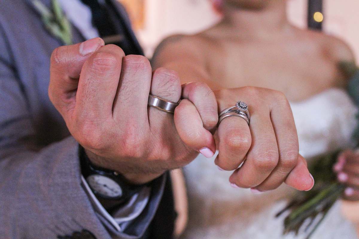 person man and woman showing silver-colored rings human