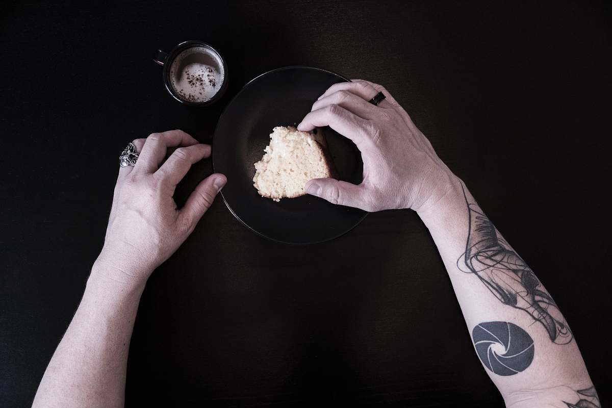 human person holding bread person