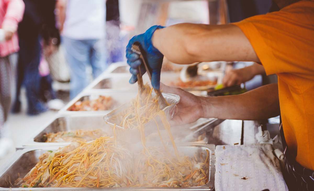 human A man serving street food in Letchworth Garden City food
