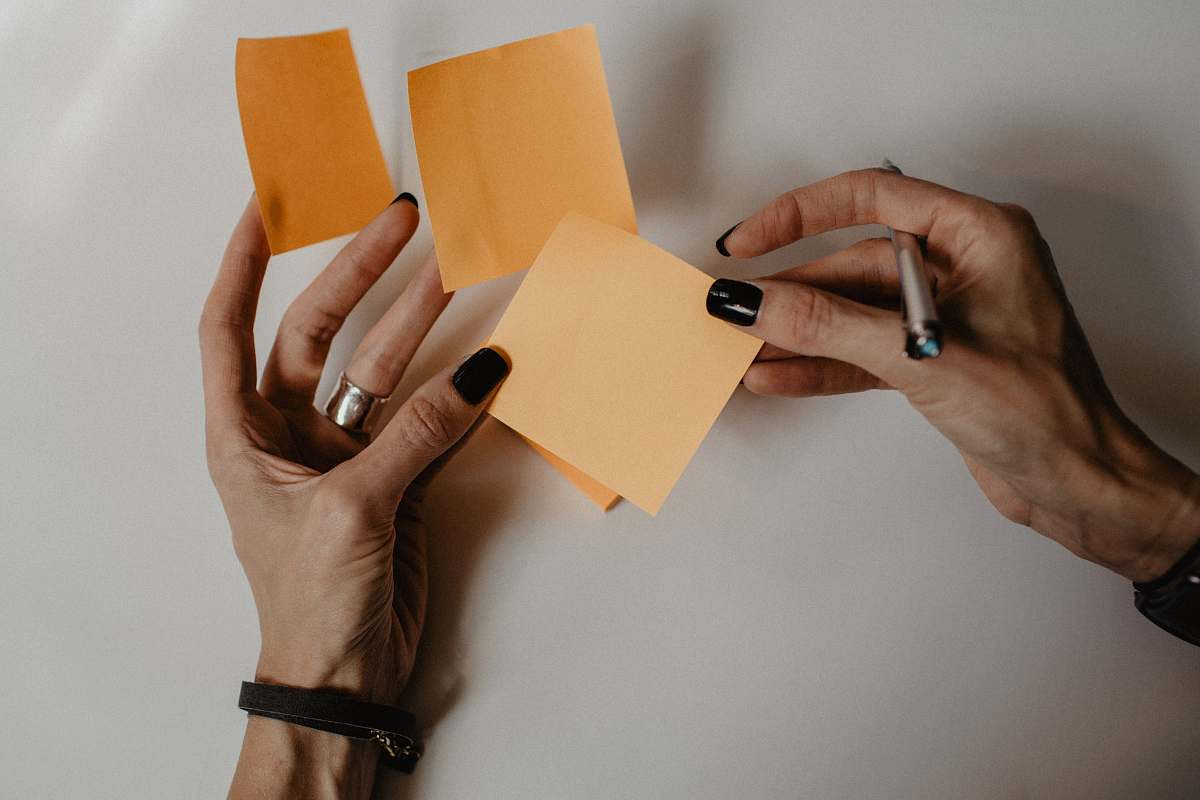 human brown sticky notes finger