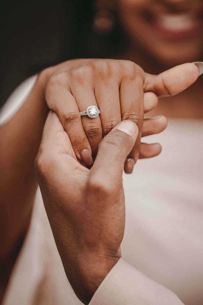 human couple holding hands hand