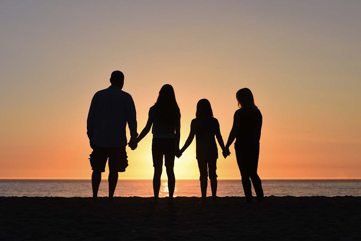 human four people on seashore people