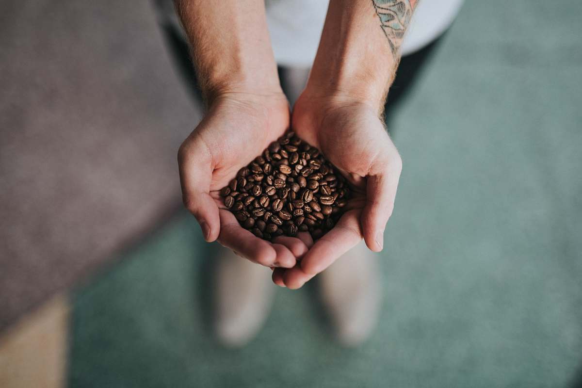 handful of decaf coffee beans