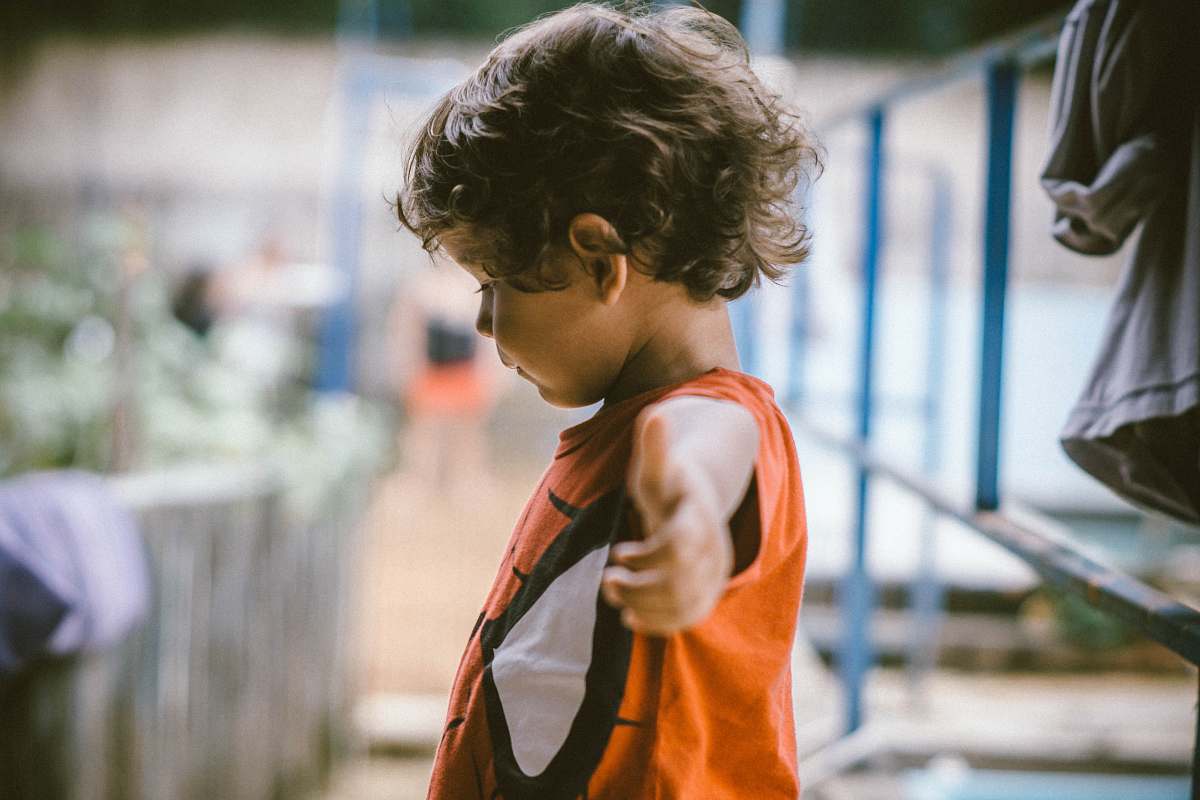 human kid wearing deadpool shirt kid