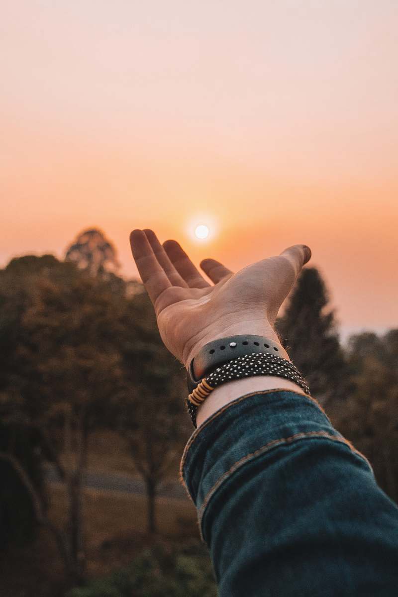 human left human hand and blue denim sleeve hand