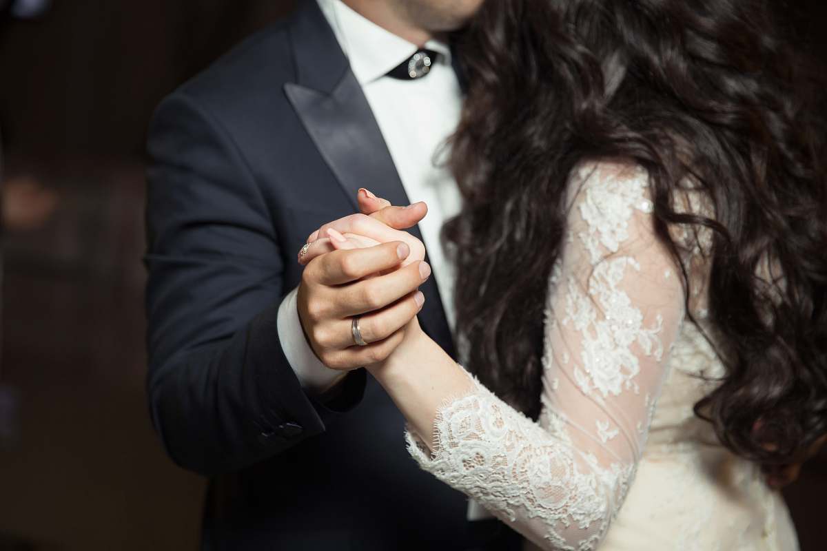 human man and woman dancing wearing casual dresses wedding