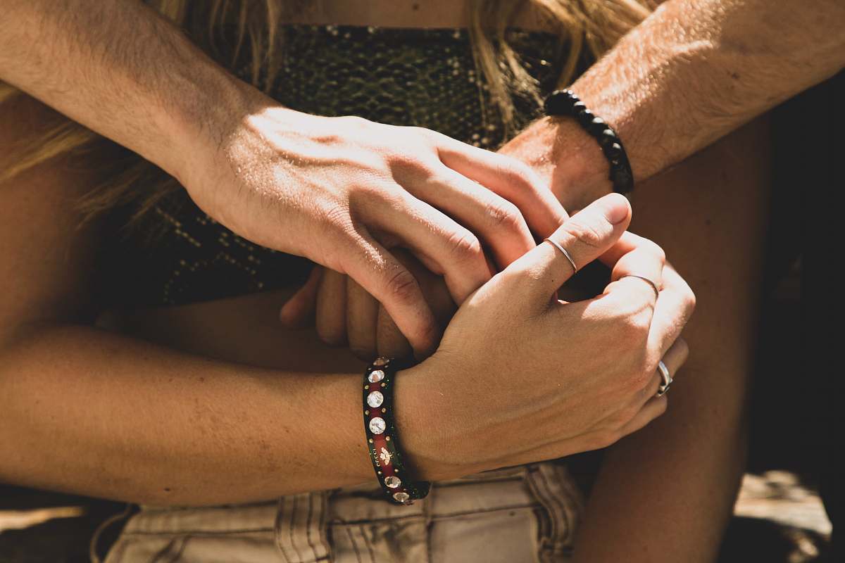 human man and woman holding hands hand