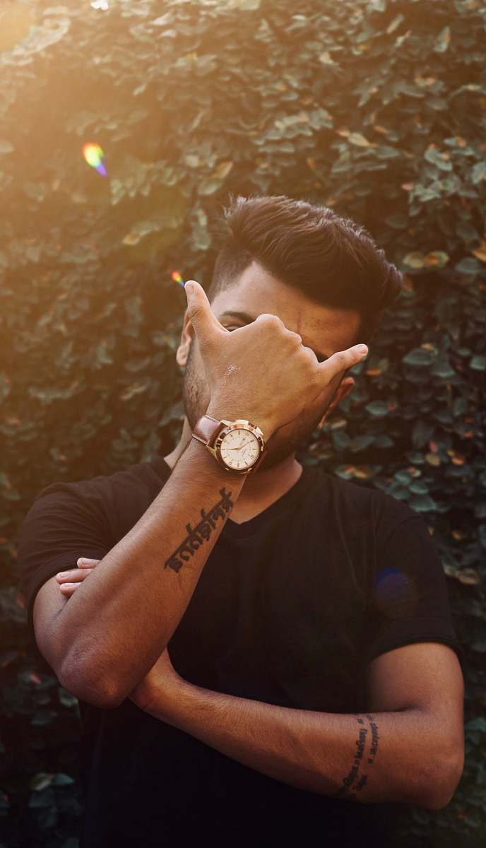 human man covering his face skin