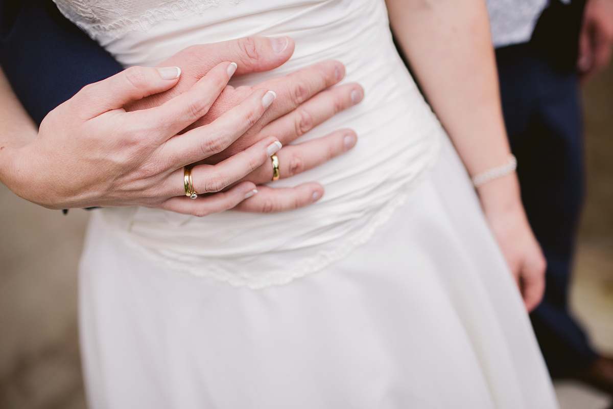 human man embracing woman waist people