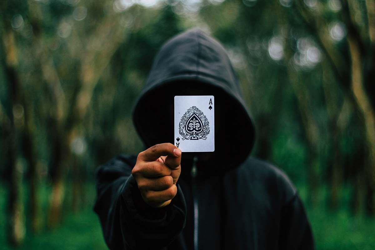 people man holding Ace of Spade card human