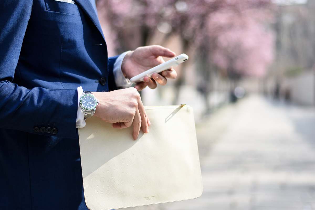 human man holding envelope taken at daytime people