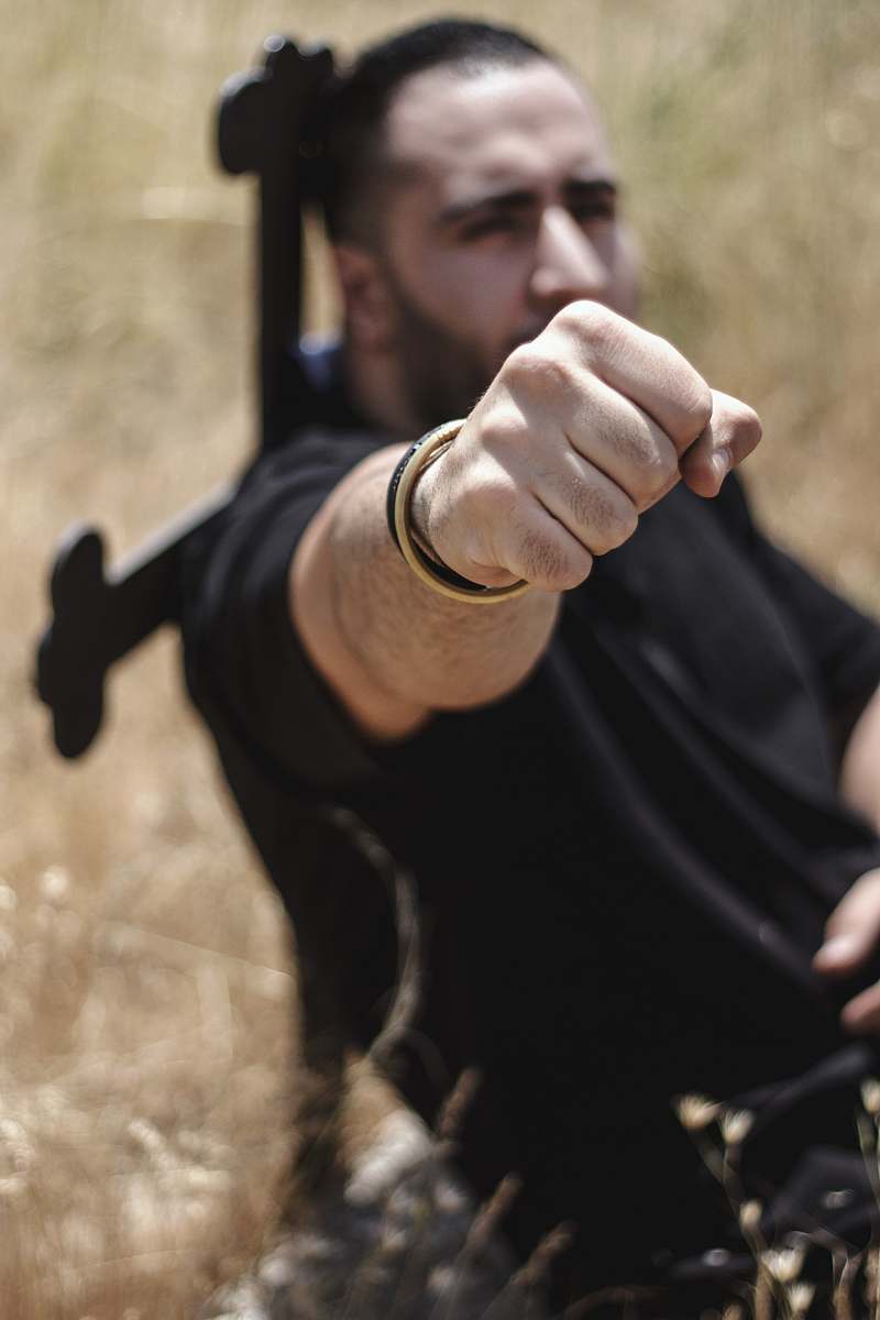 human man on selective focus photography finger