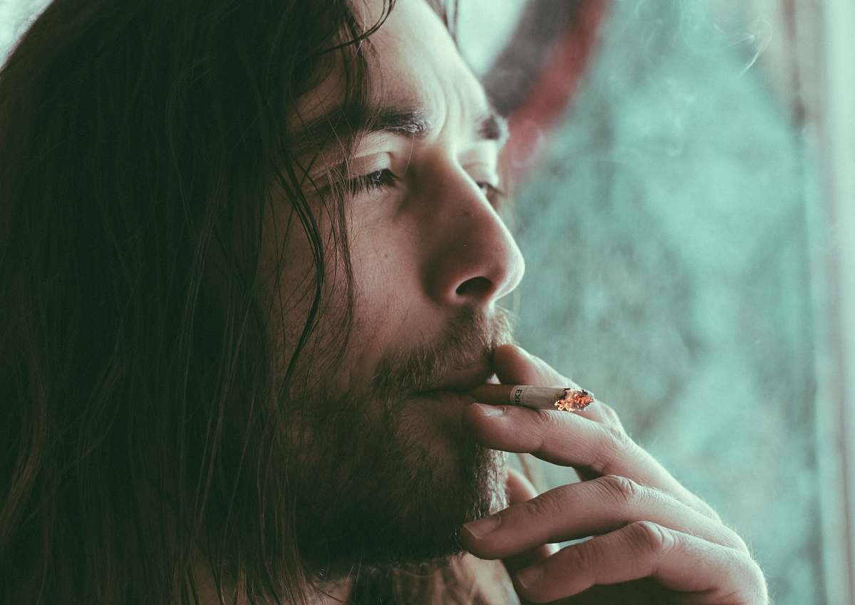 people man smoking red cigarette human