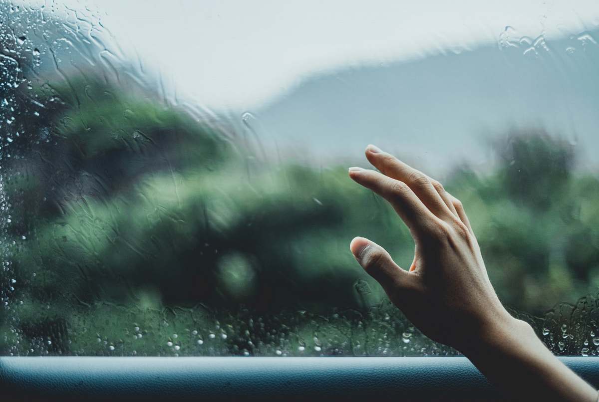 human person about to touch glass finger