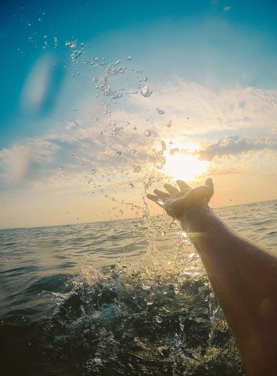 flare person catching water light