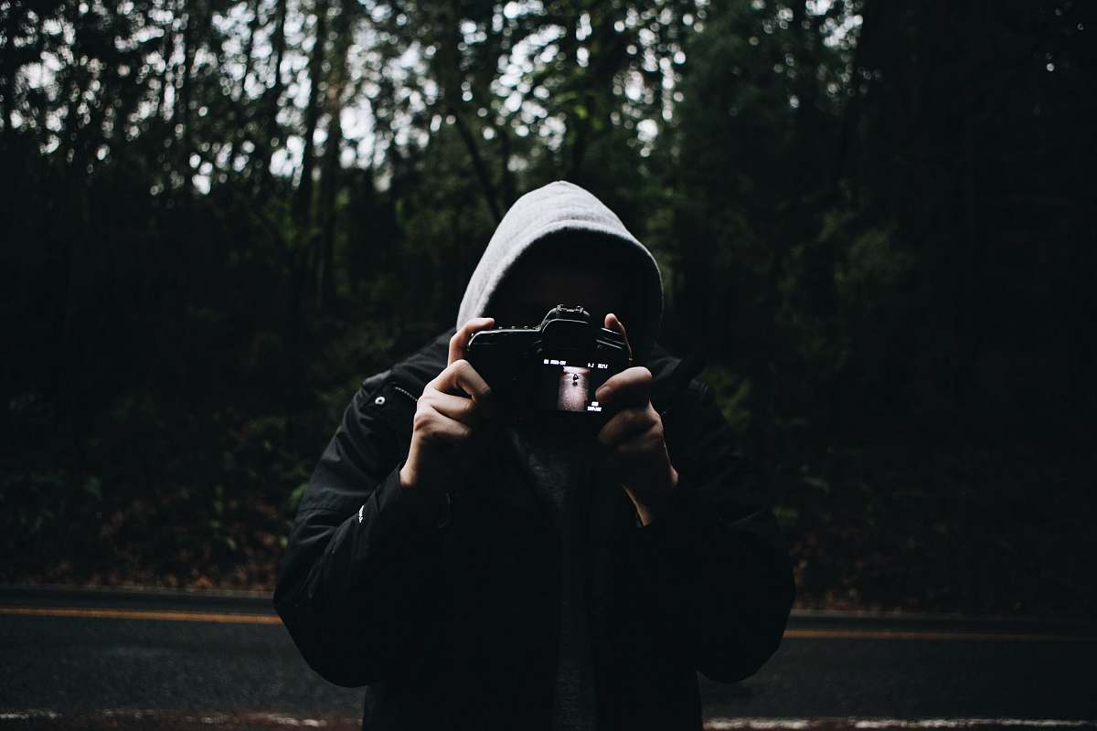 human person holding camera people