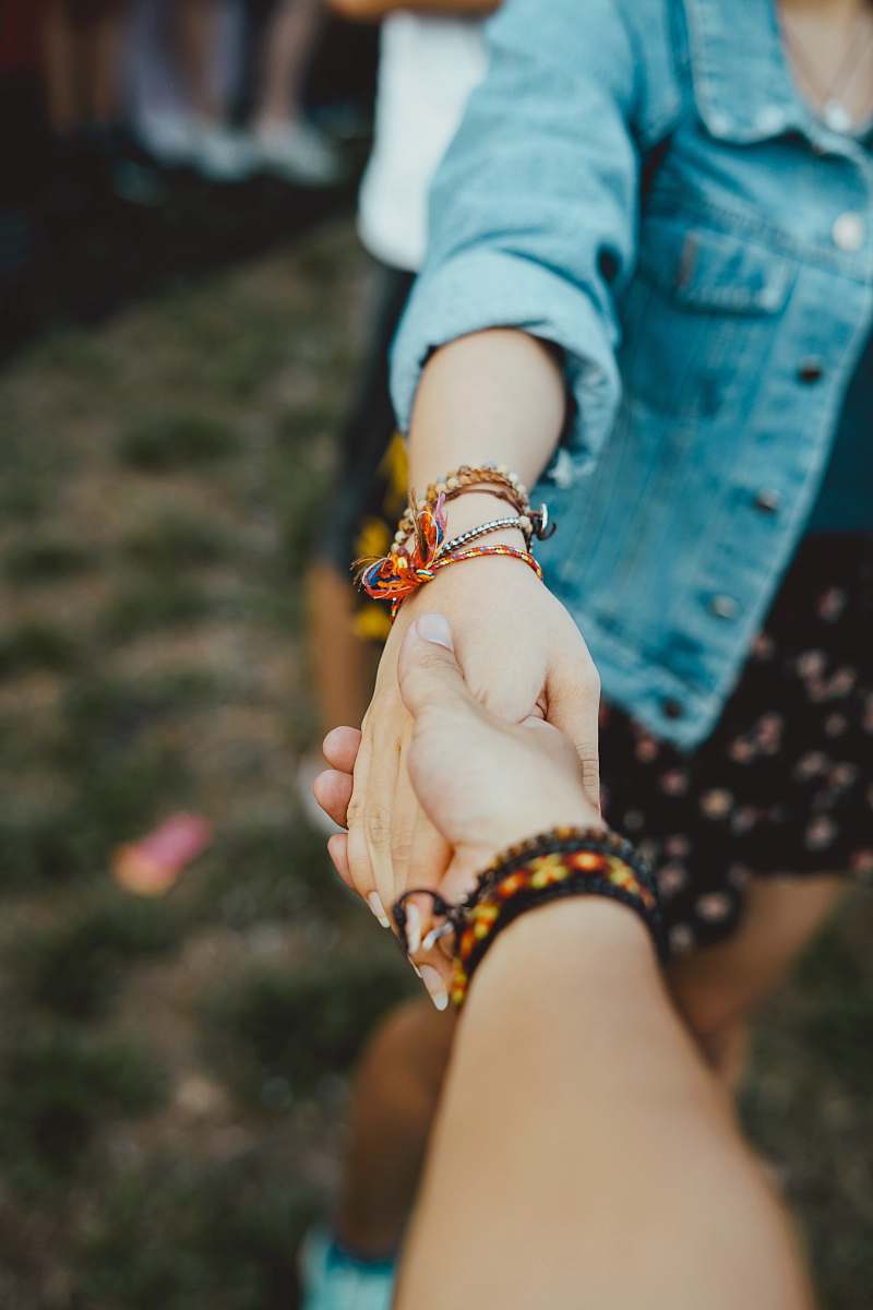 human person holding hand of woman hand