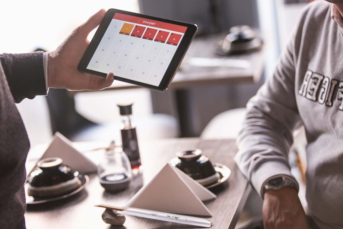 people person holding opened space gray iPad human