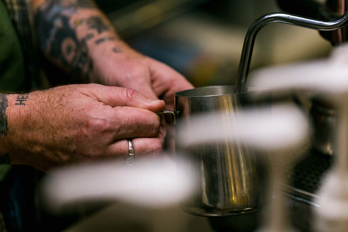 human person holding stainless steel mug people