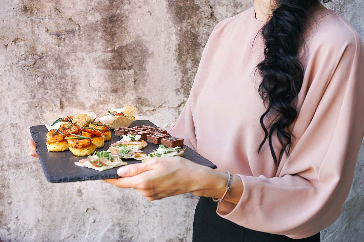 food person holding tray with foods human