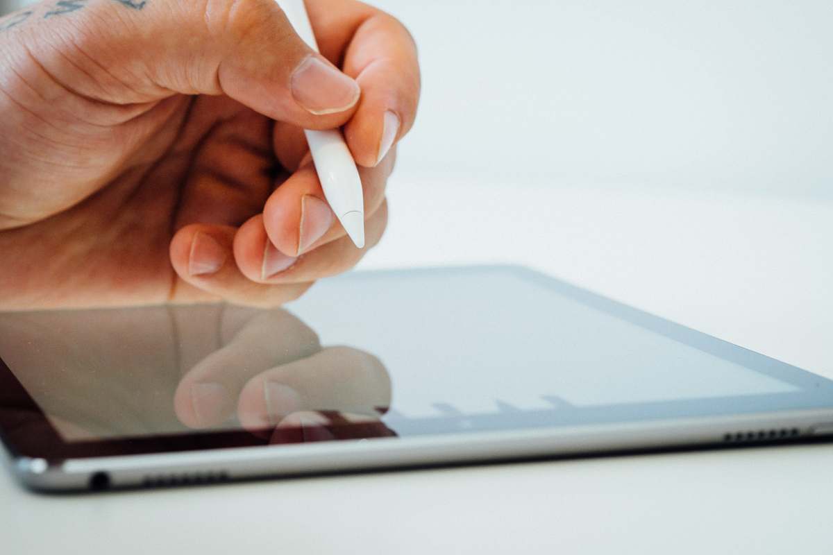 human person holding white stylus pen people