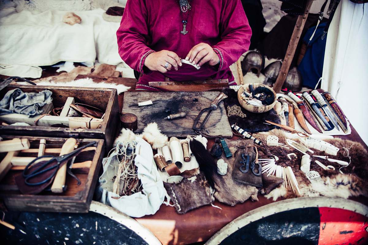 human person in pink top infront of accessories people