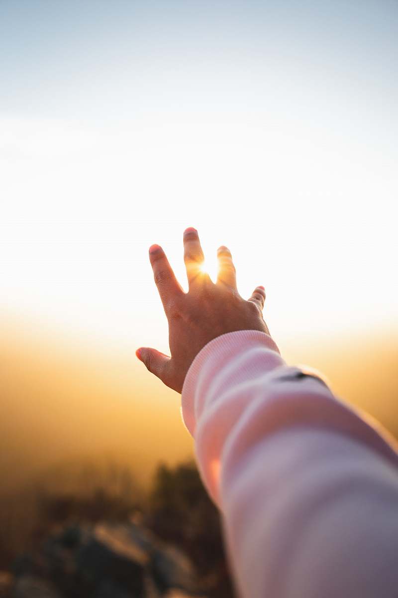 light person lifting hand flare