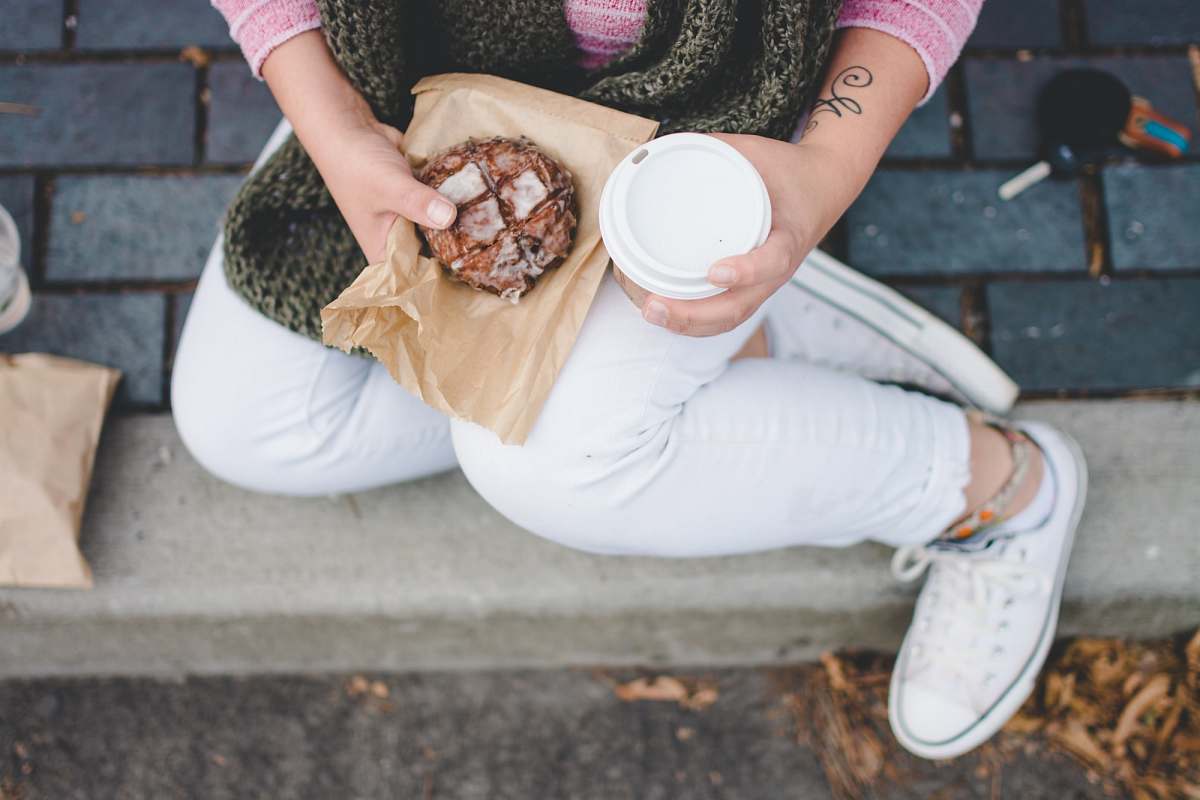 coffee person sitting while holding white tumbler portland