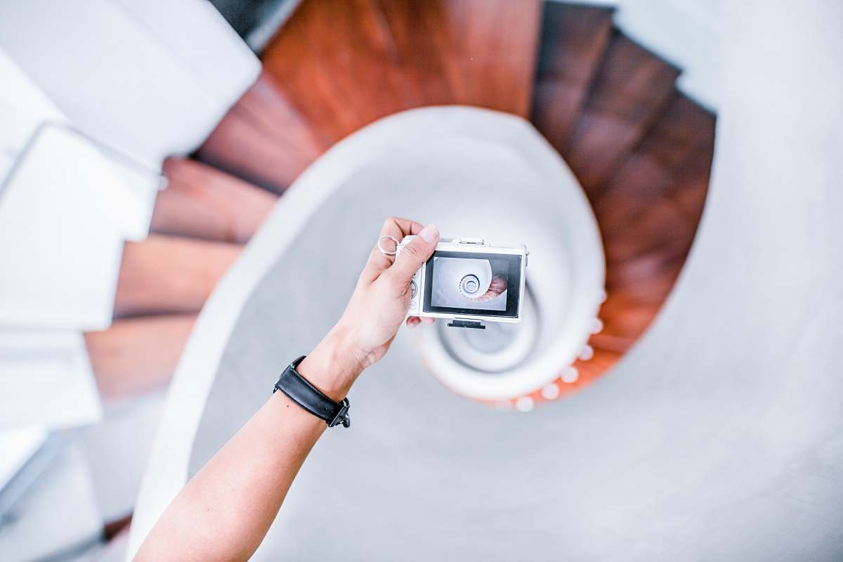 people person taking picture of white spiral staircase human