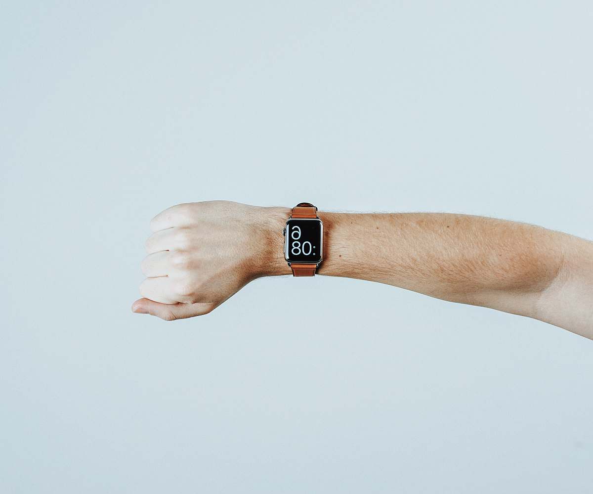 minimal person wearing Apple watch finger