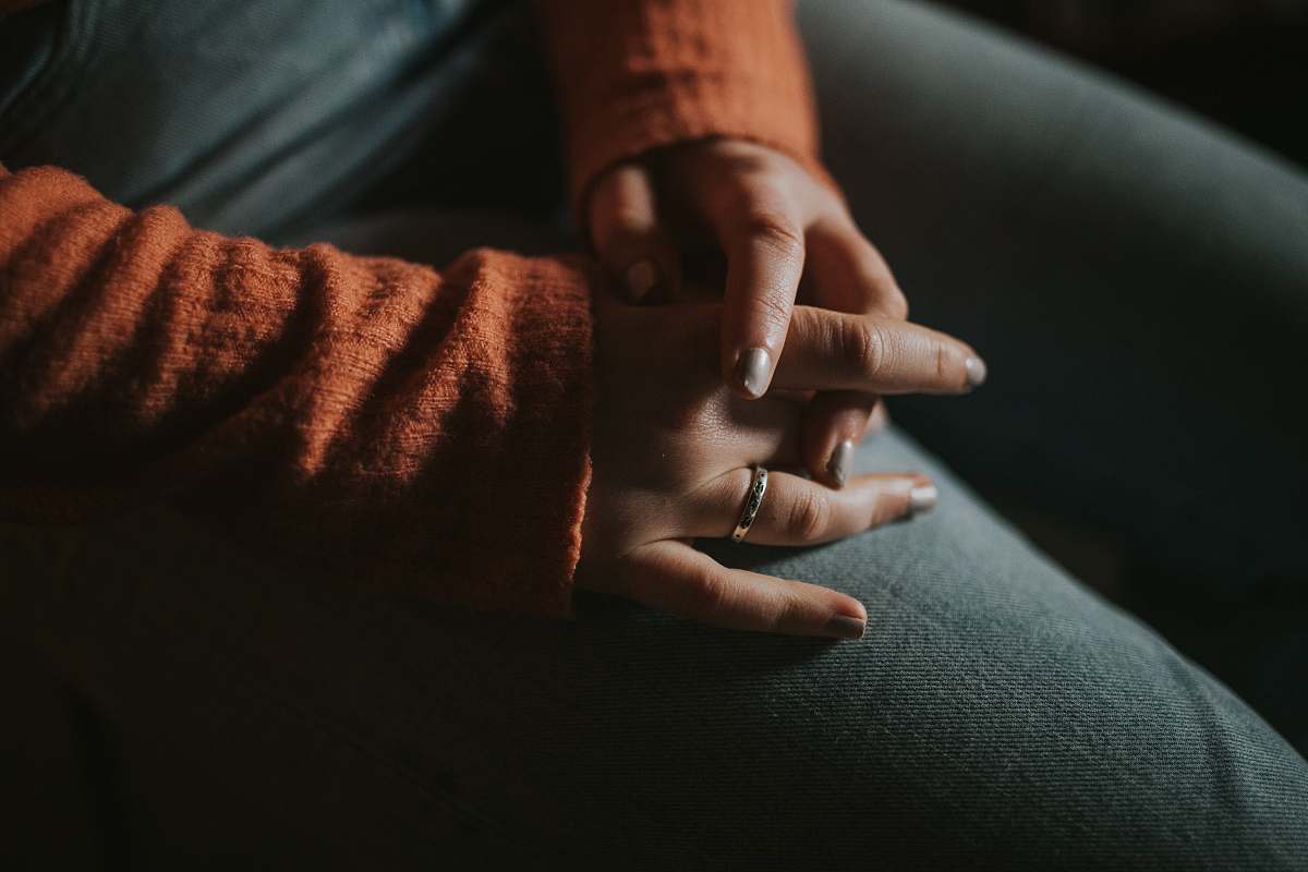 human person wearing silver-colored ring finger