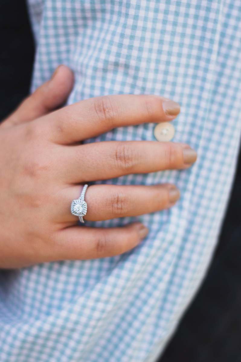human person wearing silver-colored ring with clear gemstones ellisville
