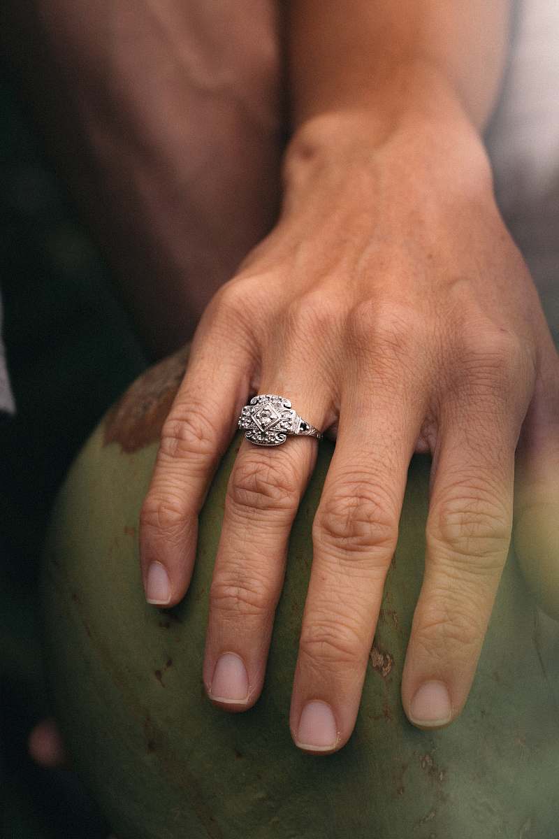 human person wearing silver diamond ring ring