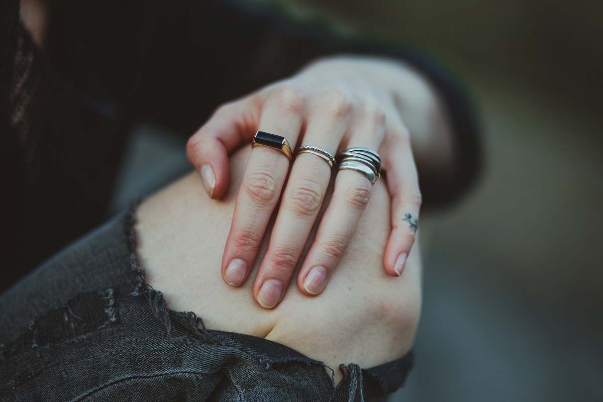 human photo of person showing silver-colored ring ring