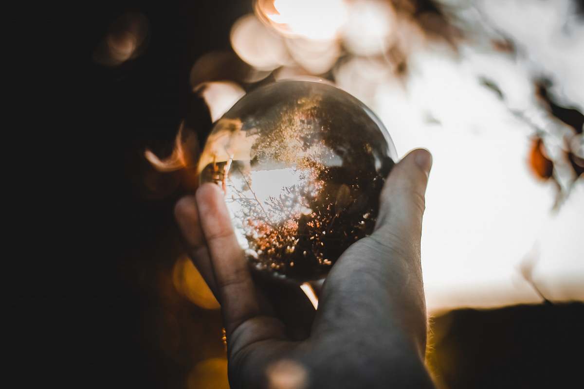 human selected focus of clear glass ball people