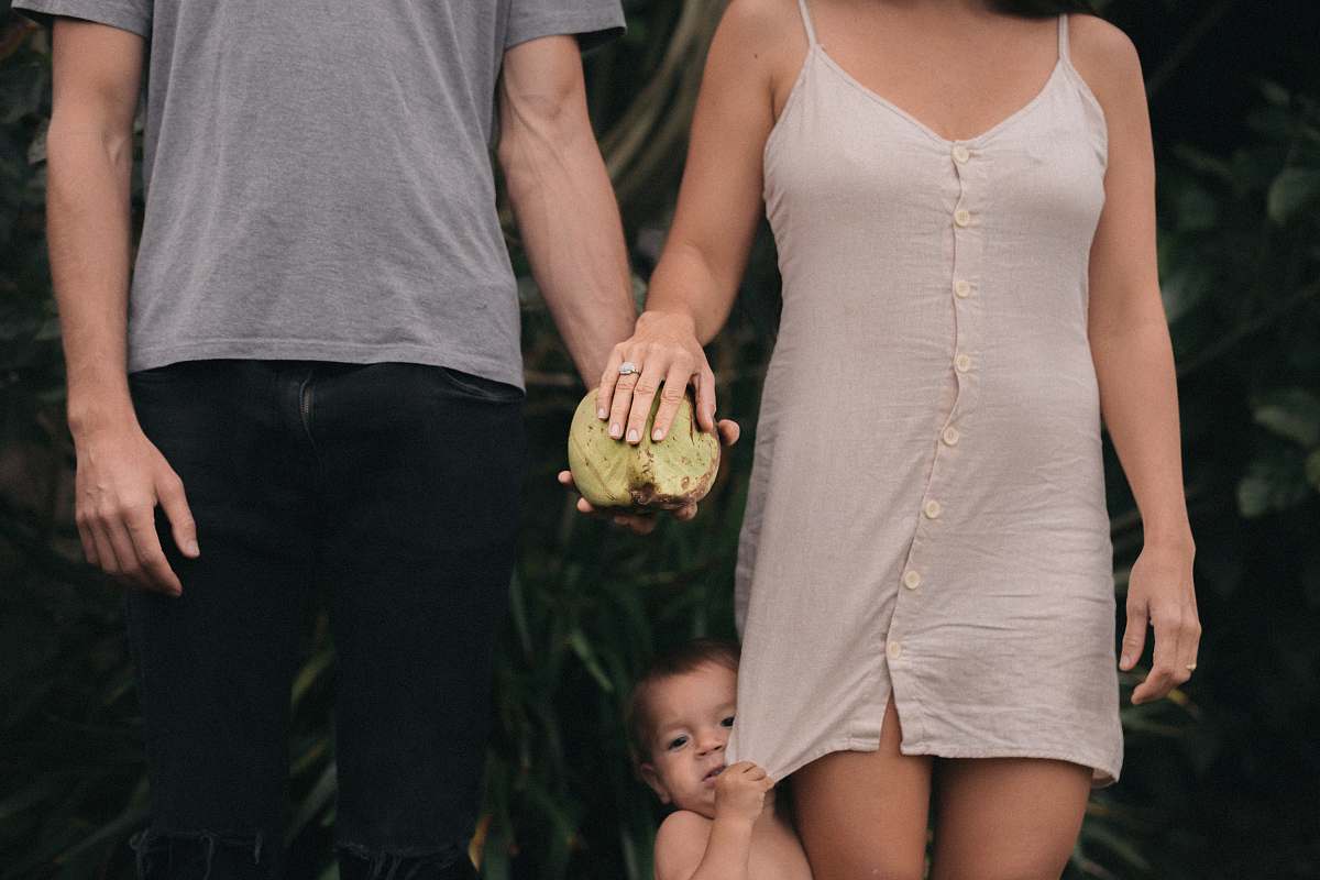 human toddler between woman and man standing apparel