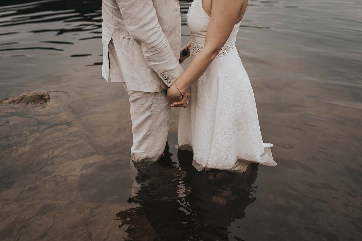 apparel two person standing on body of water clothing