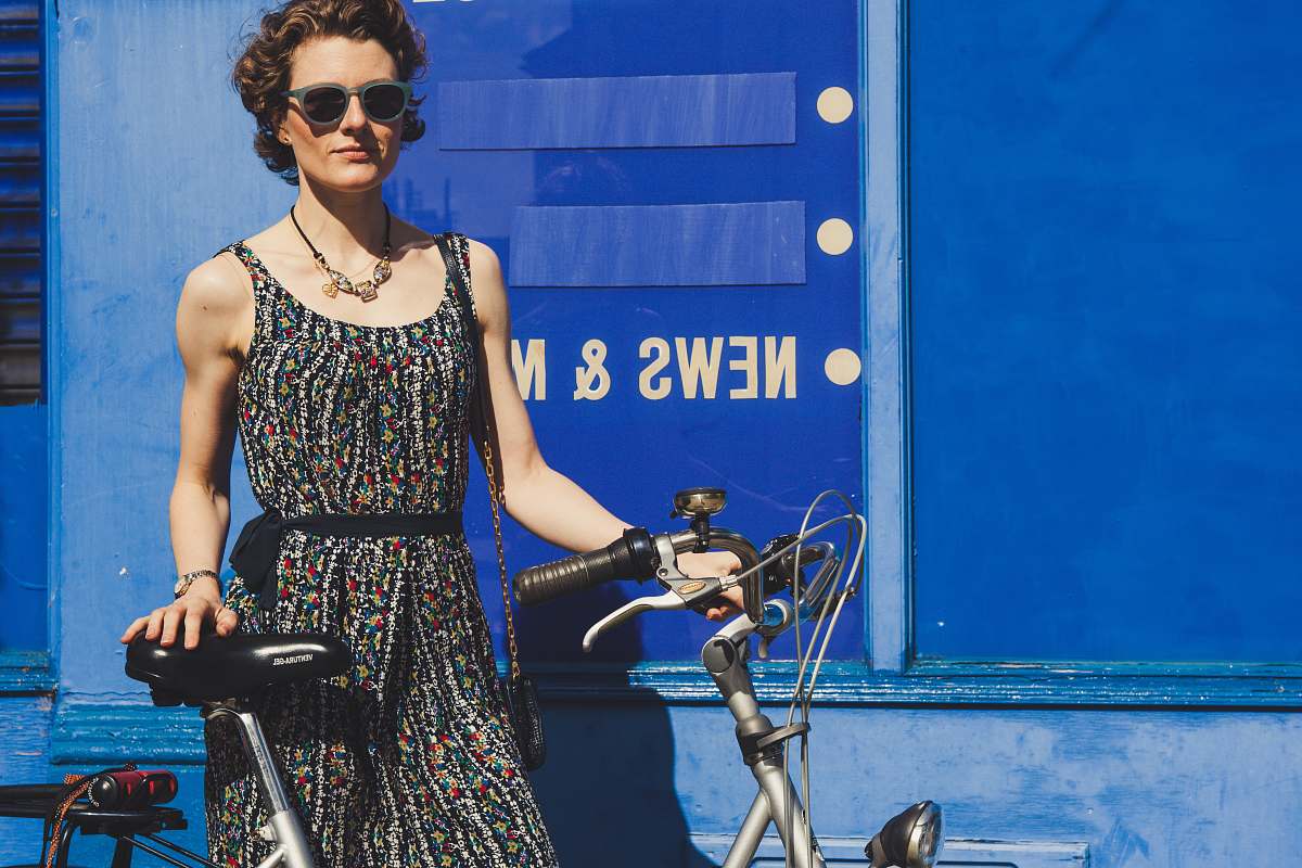 people woman holding gray bicycle bicycle