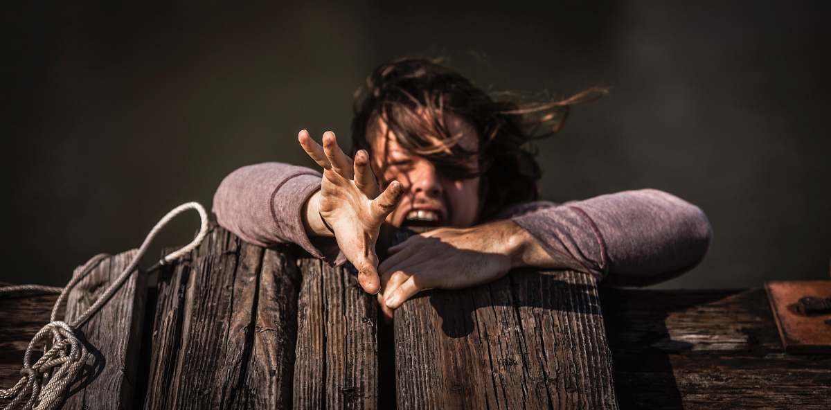human woman holding on brown wooden plank nashville