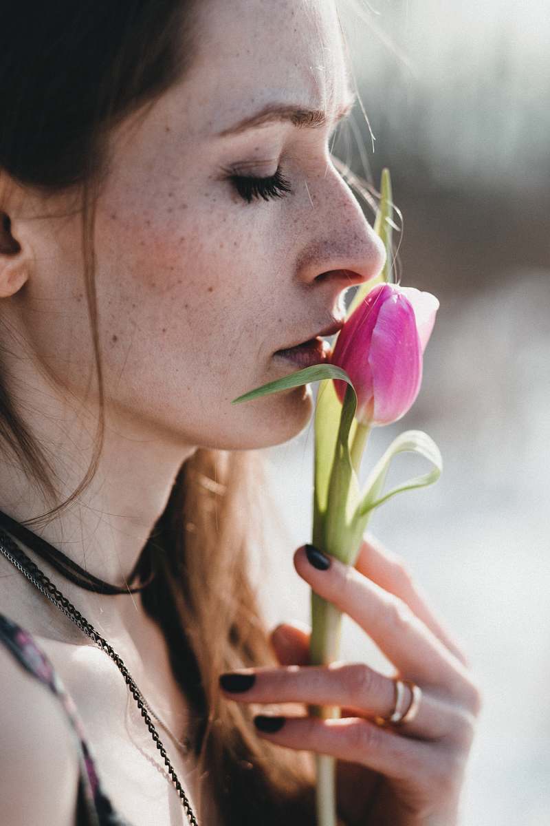 people woman holding pink rose bud human