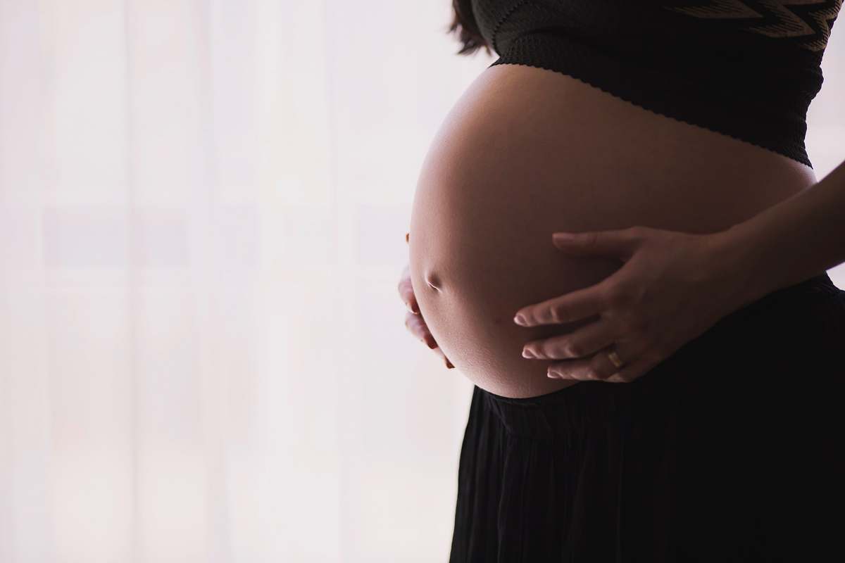 baby woman holding stomach pregnancy