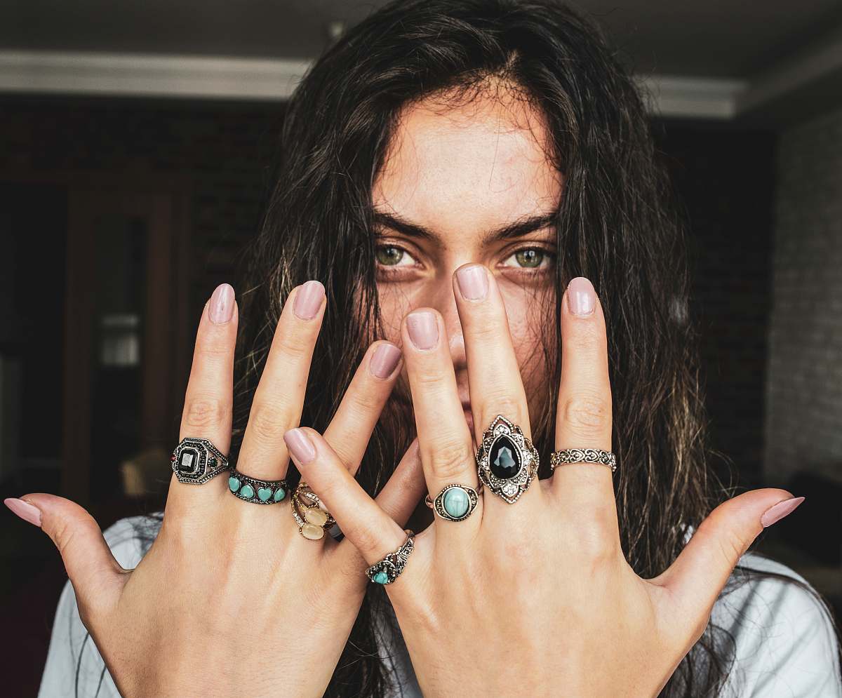 human woman showing her rings on her fingers finger