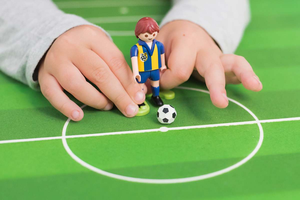 toy person playing minifig soccer game