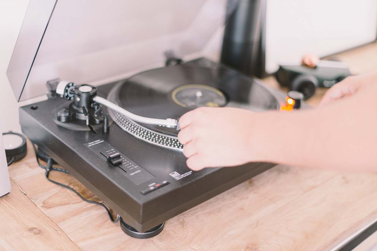 player person playing turntable record player