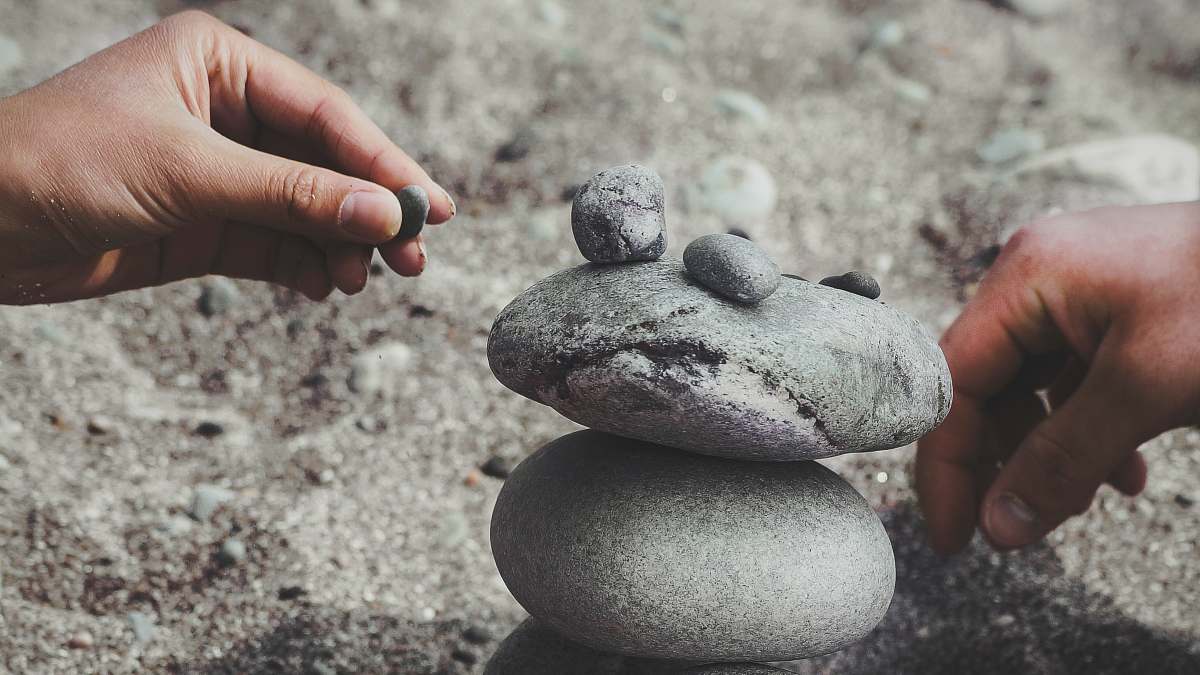 pebble person balancing rocks build