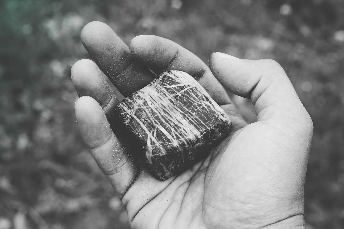 grey stone on person's hand stone