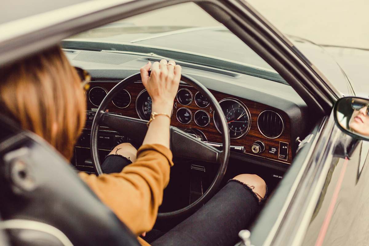 driving person sitting in the driver seat transportation