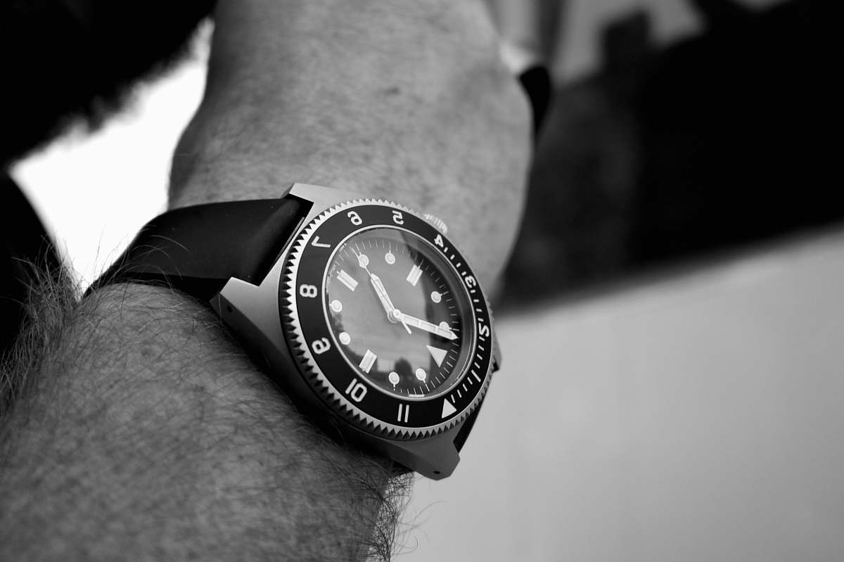 black-and-white grayscale photography of analog watch wristwatch