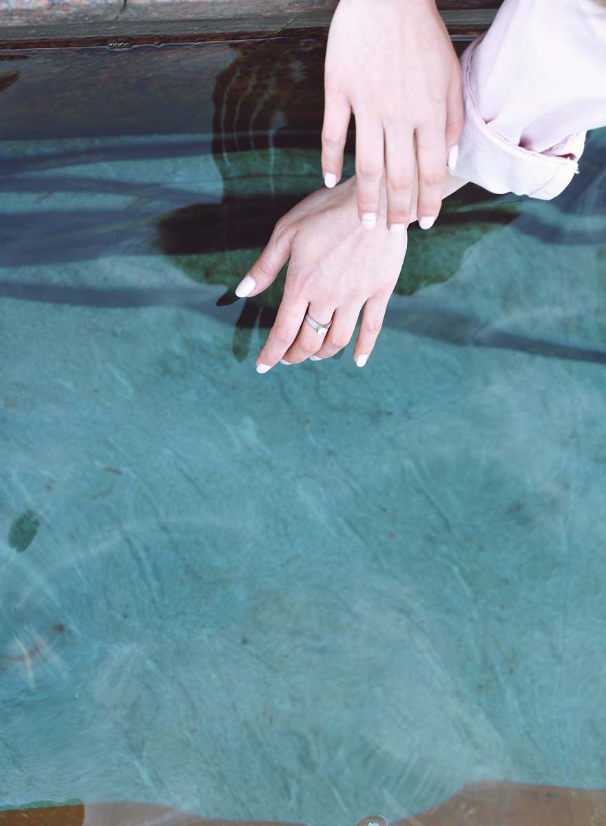hand person wearing silver-colored ring nail