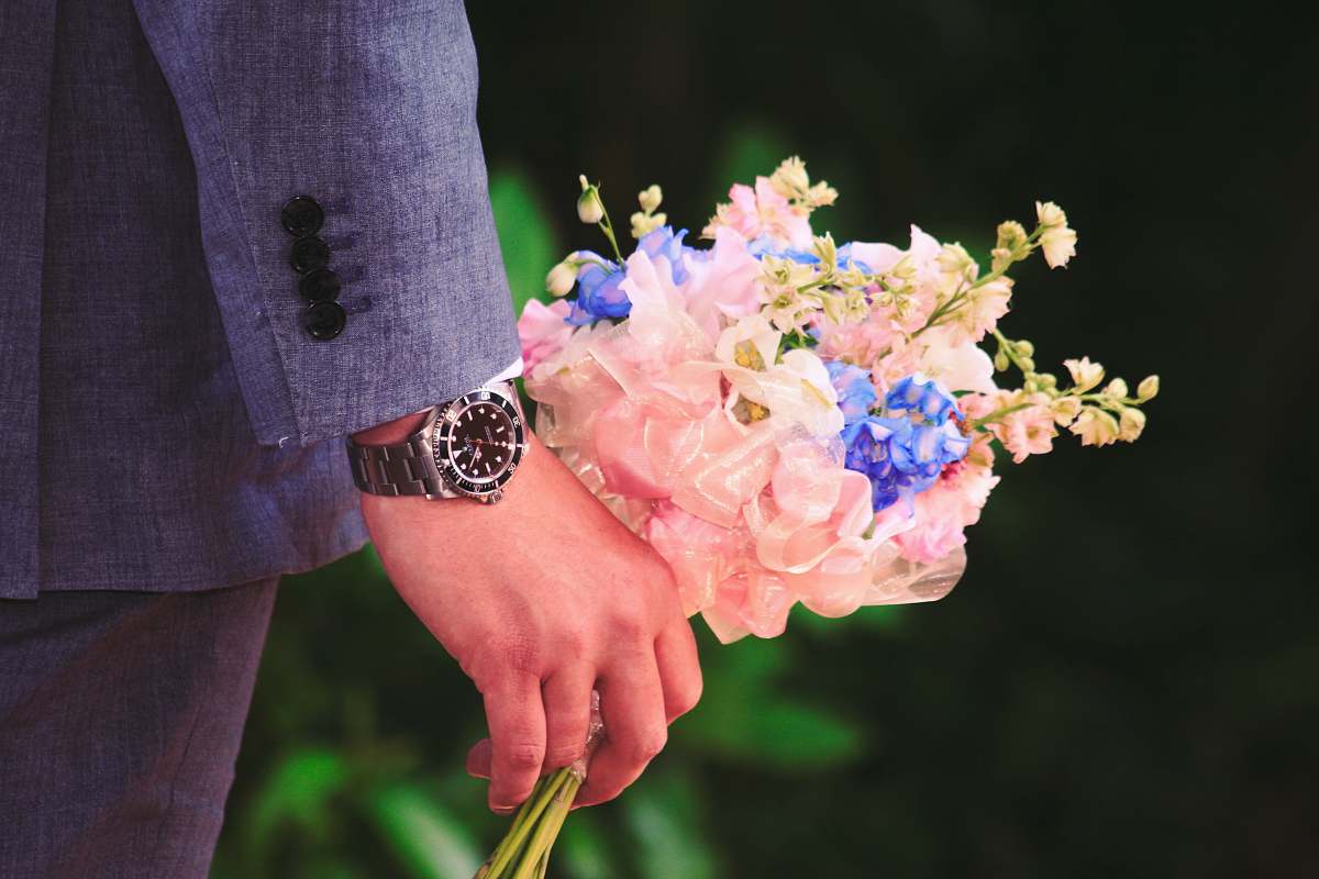 flowers close up photography of man holding flowers flower